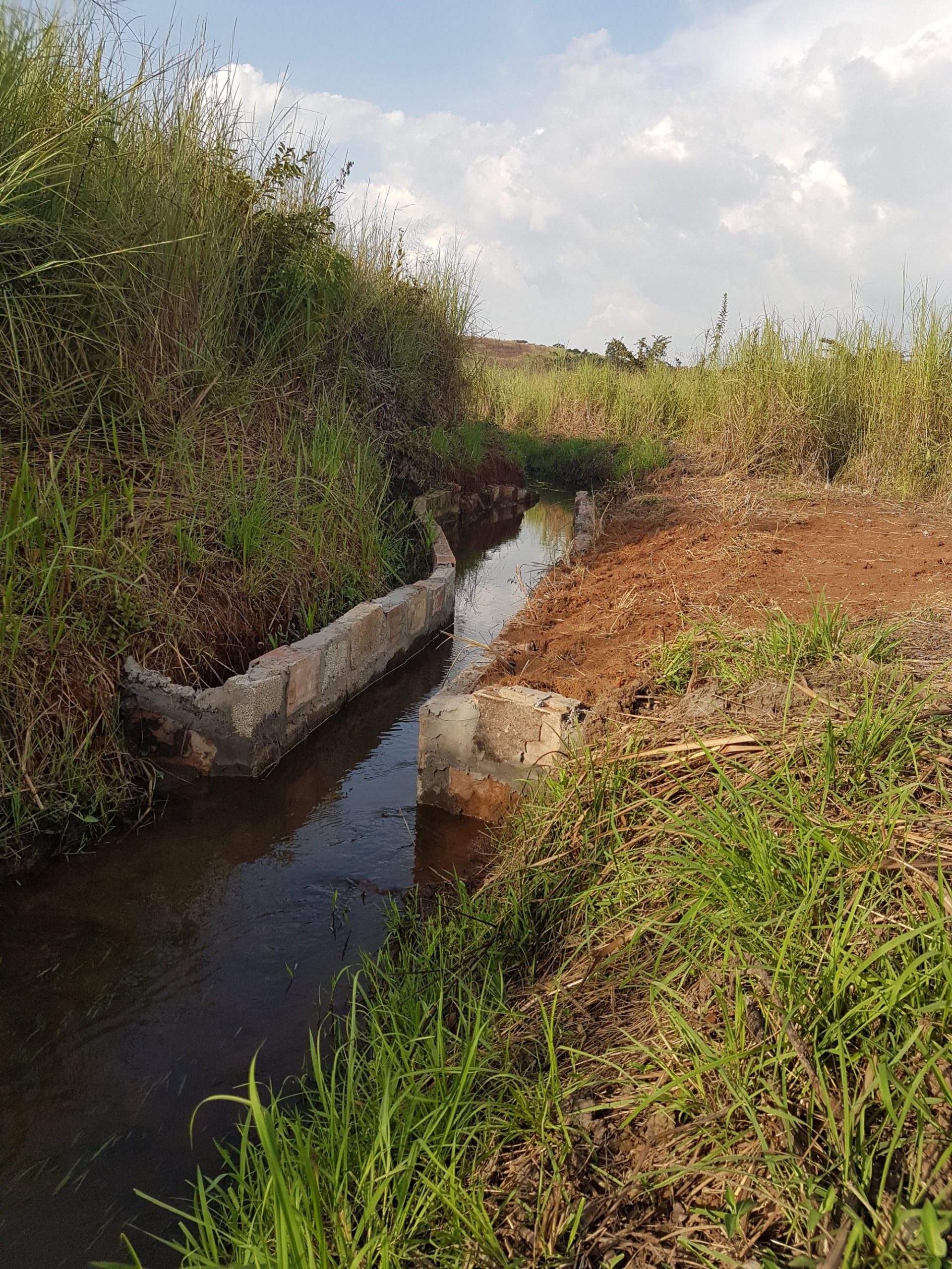 Water flowing past the completed work on Banda Makawa